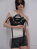 meenderi-ss-26-luce-mini-black-black-s