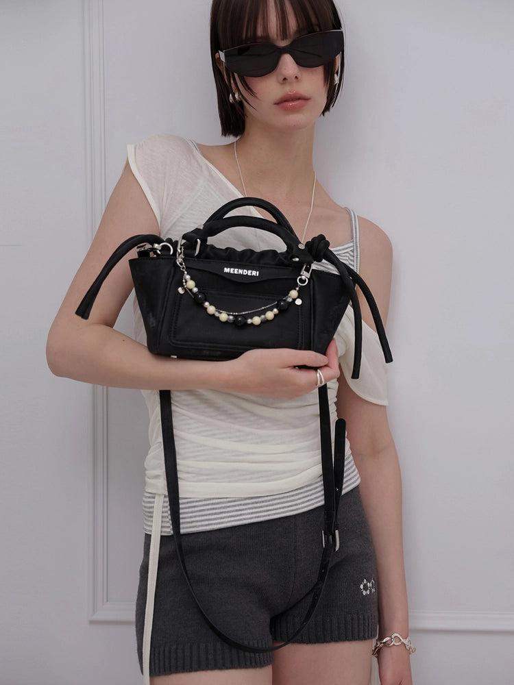 meenderi-ss-26-luce-mini-black-black-s
