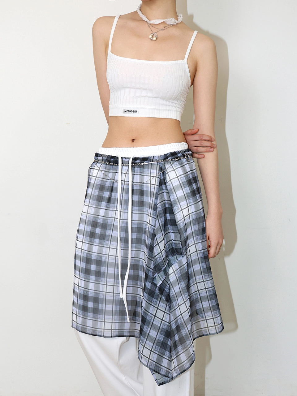 meenderi-ss-25-sheer-asymmetric-check-skirt-black